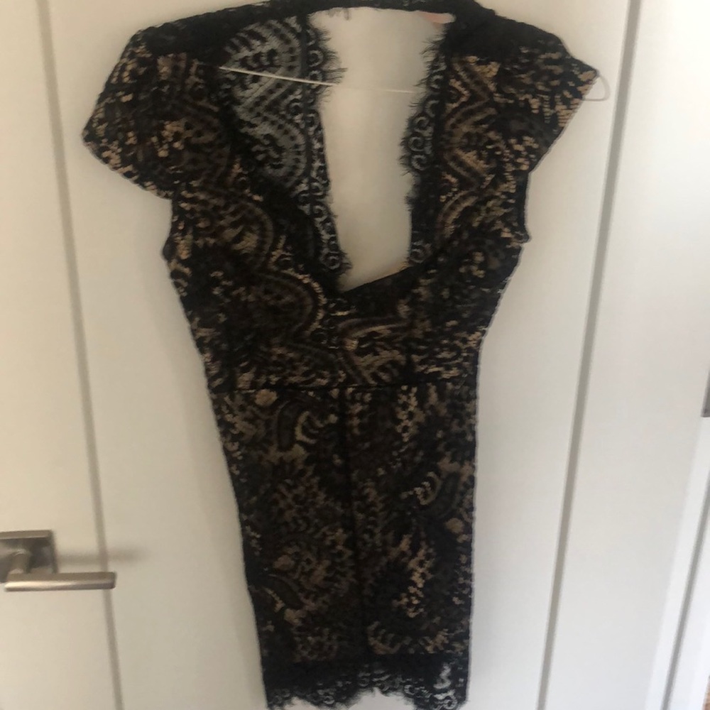 Black lace dress. Good condition. Skin tone under layer.